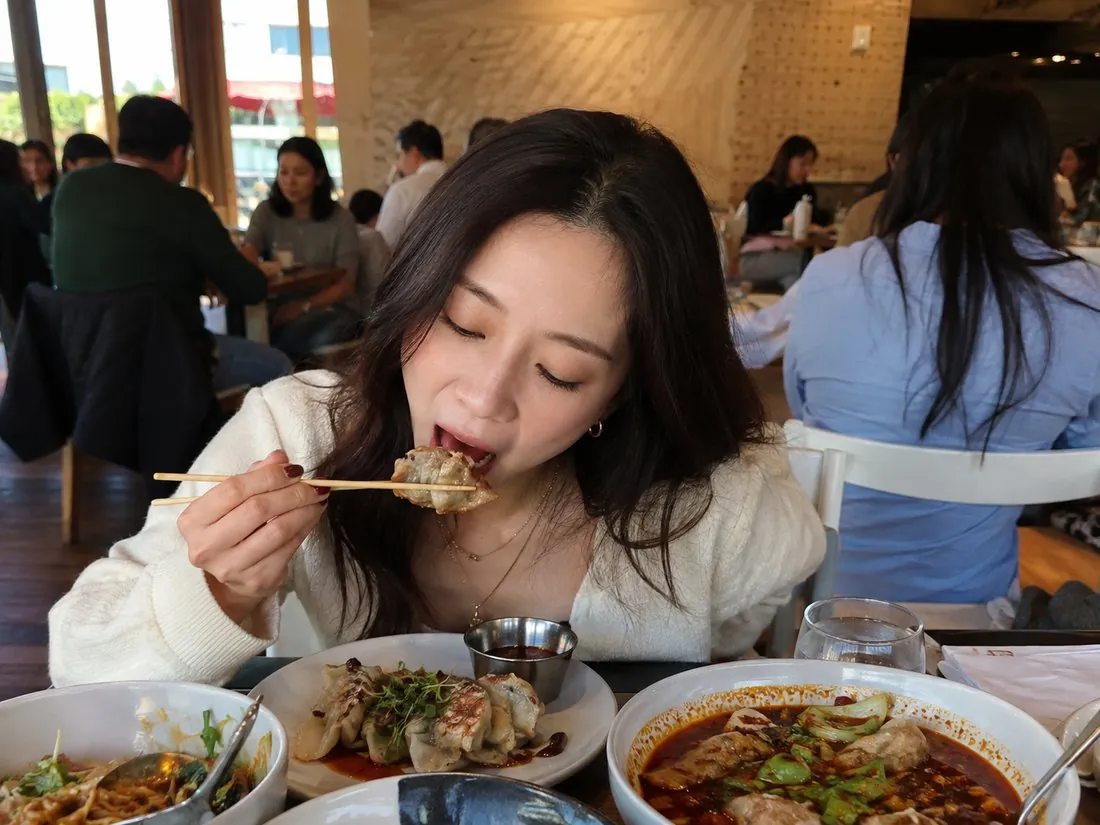 Food creator filming content at a restaurant